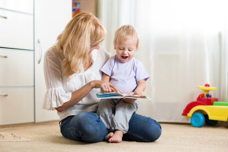 Part-time nanny reading with child