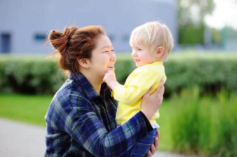 Bilingual nanny reading to child in a second language